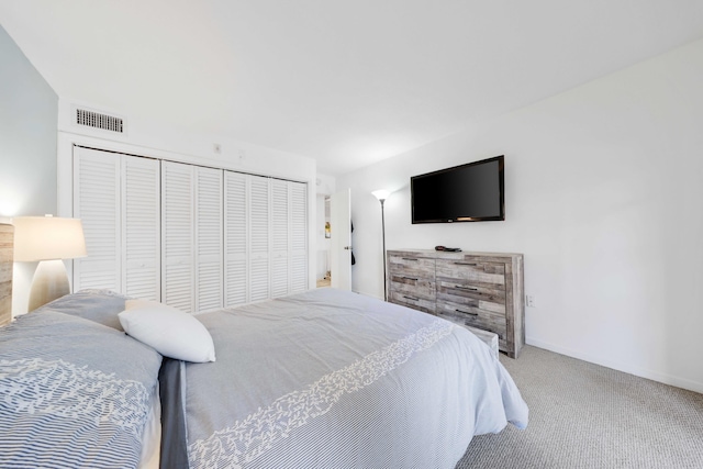 carpeted bedroom featuring a closet