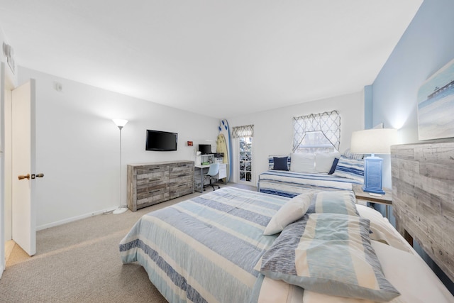 bedroom featuring light carpet