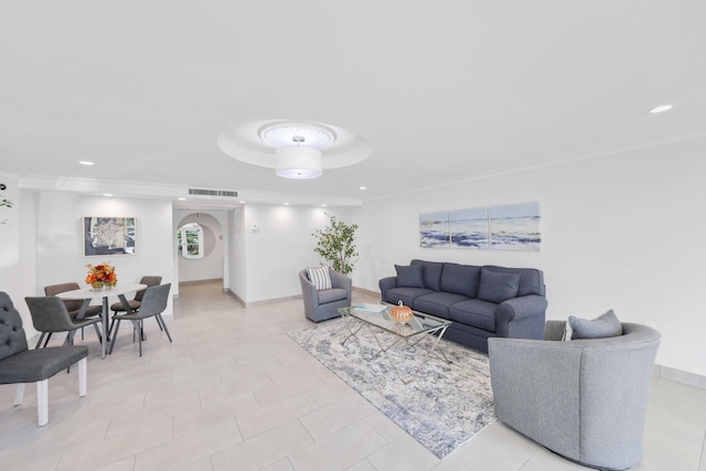 living room with light tile patterned flooring and crown molding