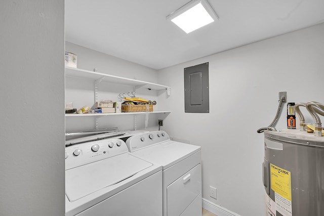 clothes washing area featuring washing machine and dryer, electric panel, and water heater