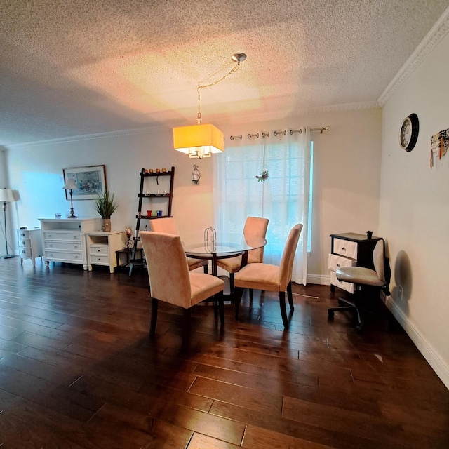 dining room with a textured ceiling, crown molding, and dark wood-type flooring