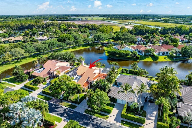 birds eye view of property featuring a water view