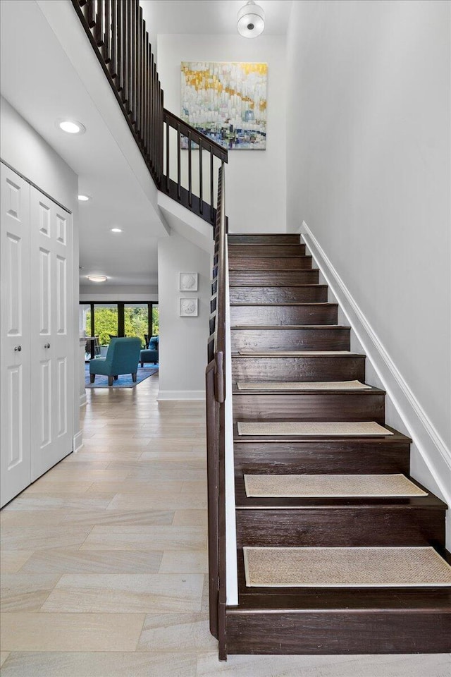 stairs featuring hardwood / wood-style floors