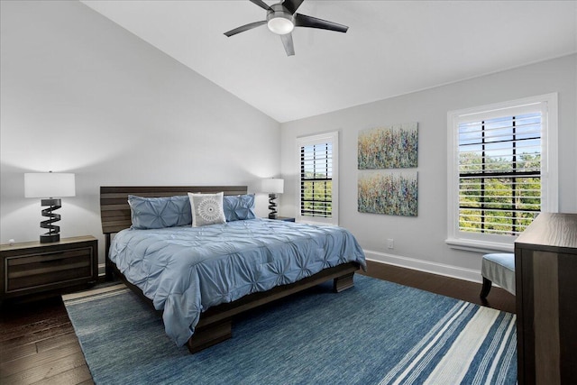 bedroom with dark hardwood / wood-style floors, ceiling fan, and lofted ceiling