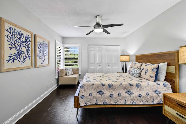 bedroom with a closet, ceiling fan, and dark hardwood / wood-style flooring