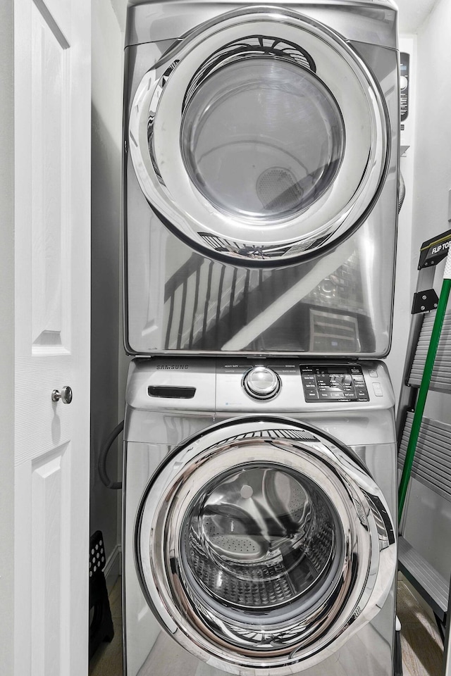 laundry room with stacked washer and clothes dryer