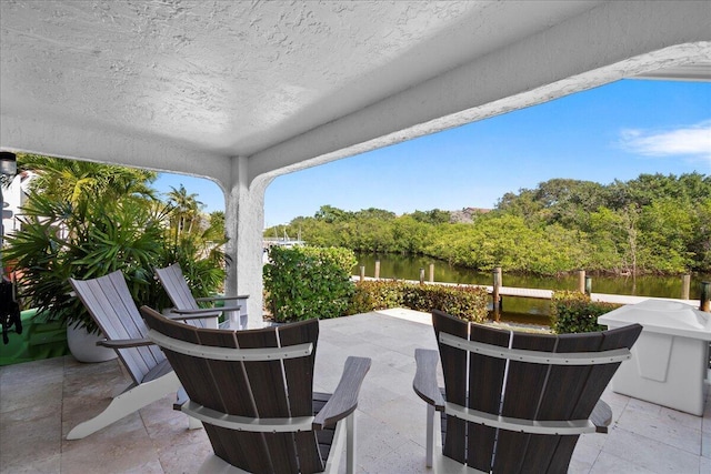 view of patio featuring a water view