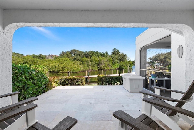 view of patio with a water view