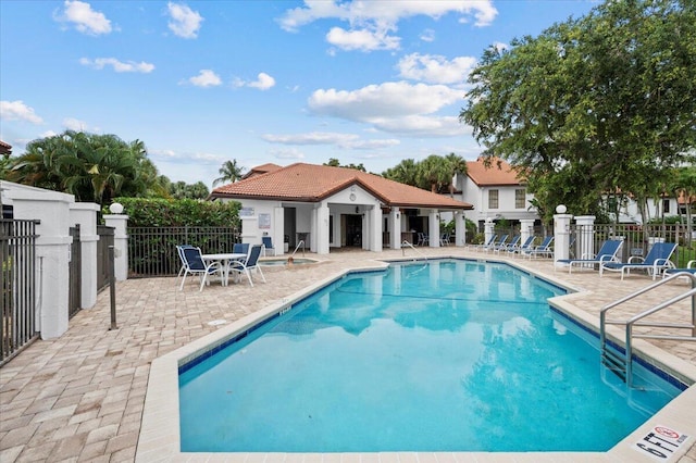 view of swimming pool with a patio