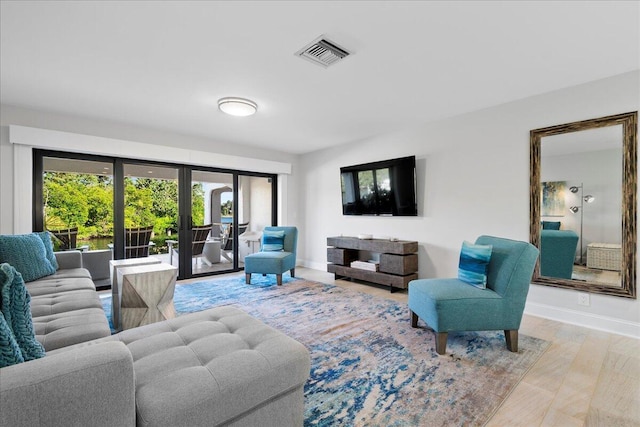 living room featuring french doors and hardwood / wood-style flooring