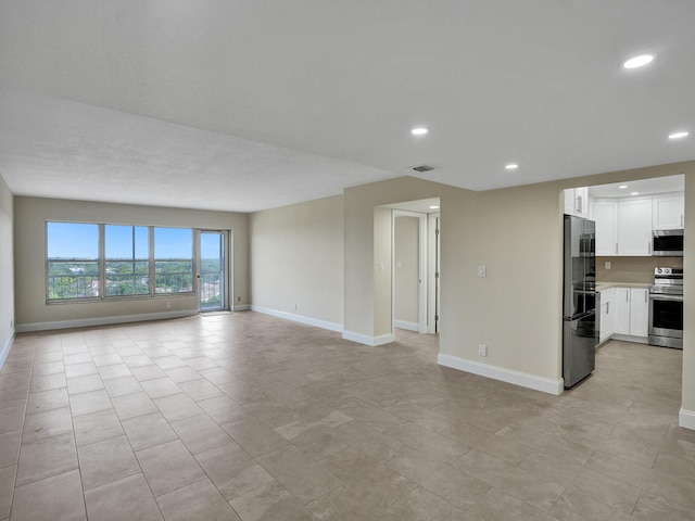 unfurnished living room with light tile patterned floors