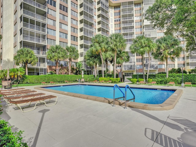 view of swimming pool featuring a patio