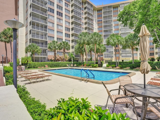 view of swimming pool featuring a patio area