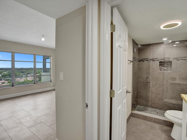 bathroom featuring toilet, tile patterned floors, and a shower with door