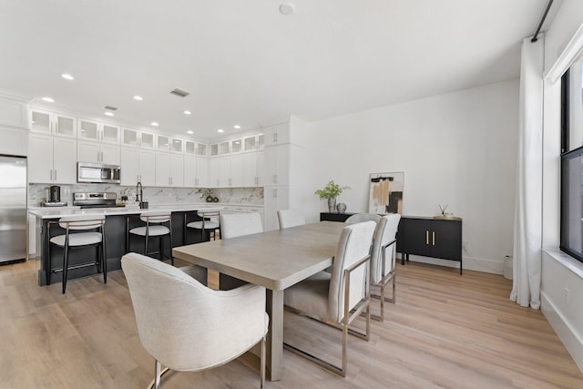 dining area featuring light hardwood / wood-style floors