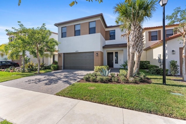 view of front facade featuring a front lawn and a garage