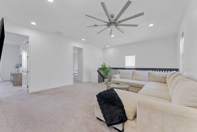 carpeted living room featuring ceiling fan