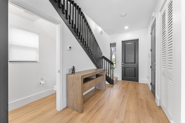 entrance foyer with light hardwood / wood-style flooring