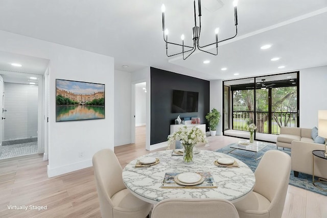 dining space with light wood-type flooring