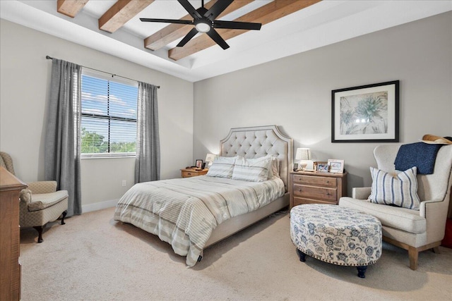 bedroom featuring carpet, ceiling fan, and beam ceiling