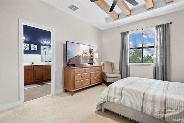 carpeted bedroom with ceiling fan and connected bathroom