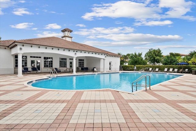 view of swimming pool with a patio area