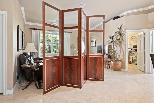 foyer featuring ornamental molding