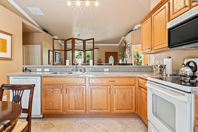 kitchen featuring sink, kitchen peninsula, crown molding, lofted ceiling, and white appliances