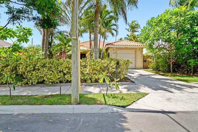 view of front of property with a garage