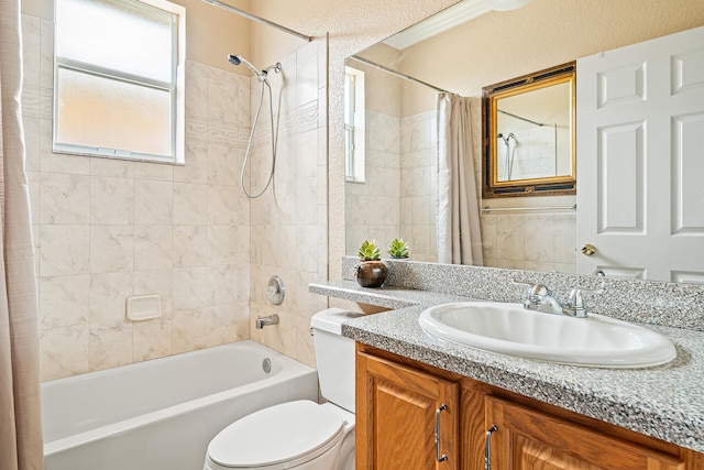 full bathroom featuring vanity, shower / tub combo, and toilet