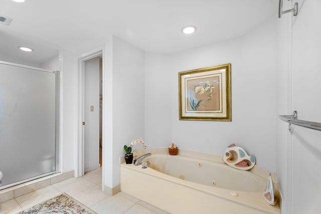 bathroom with tile patterned floors and independent shower and bath