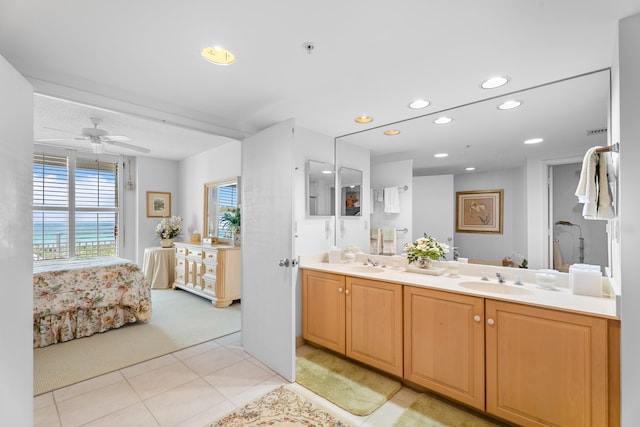 bathroom with tile patterned floors, ceiling fan, and vanity