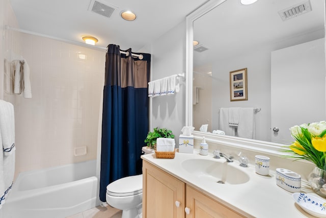 full bathroom featuring tile patterned floors, vanity, toilet, and shower / bath combo with shower curtain