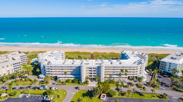 bird's eye view featuring a beach view and a water view