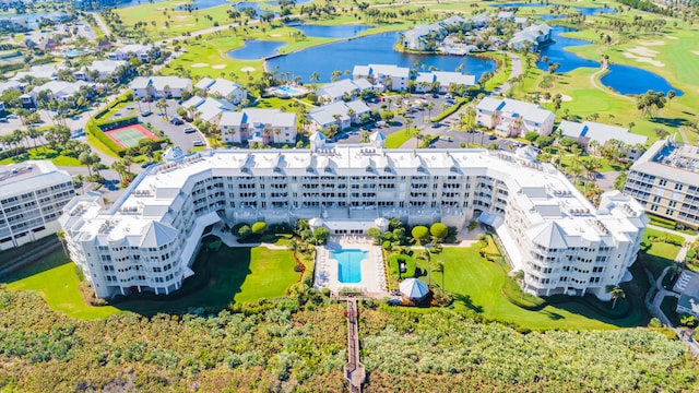 birds eye view of property with a water view