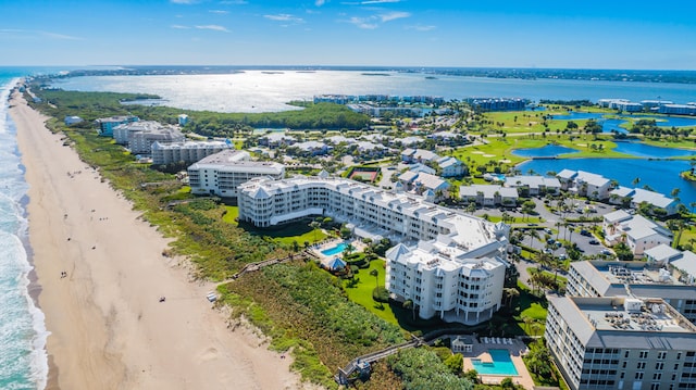 drone / aerial view with a view of the beach and a water view