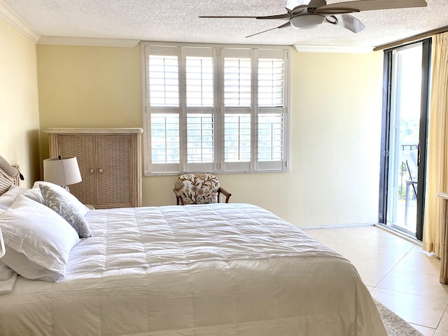 tiled bedroom featuring access to outside, ceiling fan, a textured ceiling, and ornamental molding