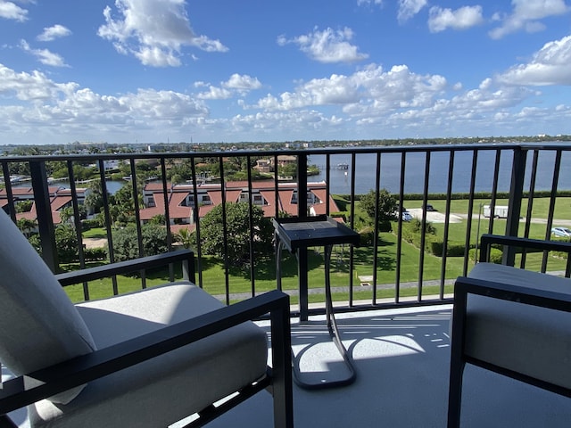 balcony featuring a water view