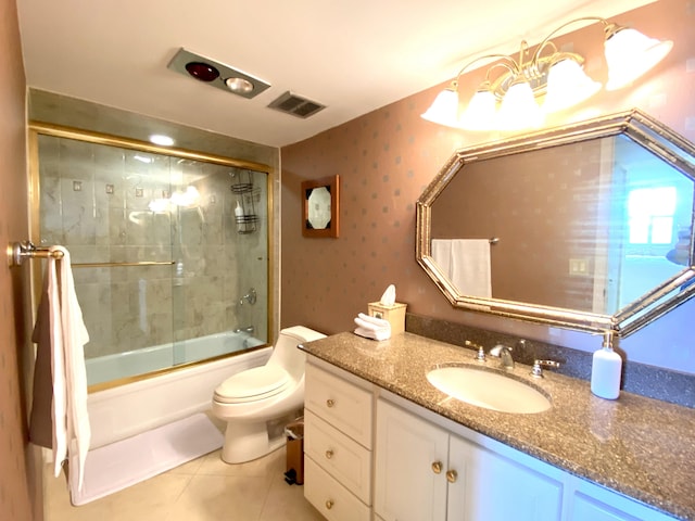 full bathroom featuring tile patterned floors, vanity, toilet, and combined bath / shower with glass door