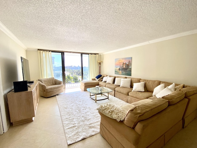 living room featuring a wall of windows, a textured ceiling, light tile patterned floors, and ornamental molding