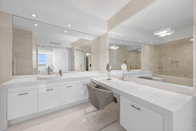 bathroom with tile patterned flooring, vanity, and washtub / shower combination