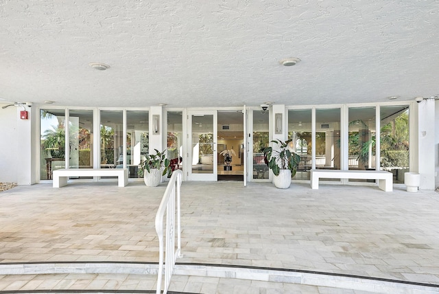 entrance to property featuring french doors