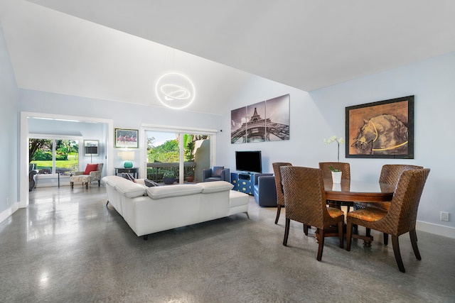 living room with concrete flooring and lofted ceiling