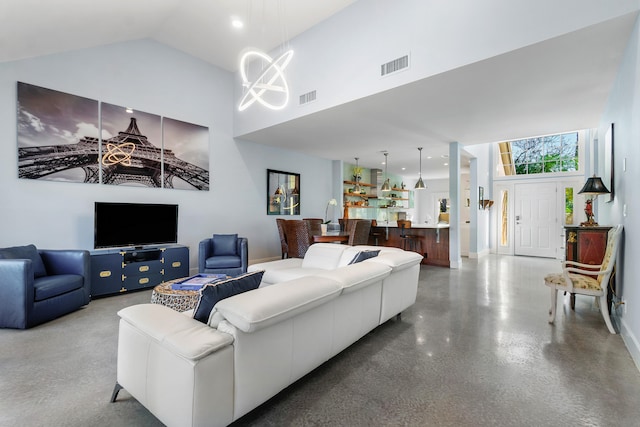 living room featuring high vaulted ceiling