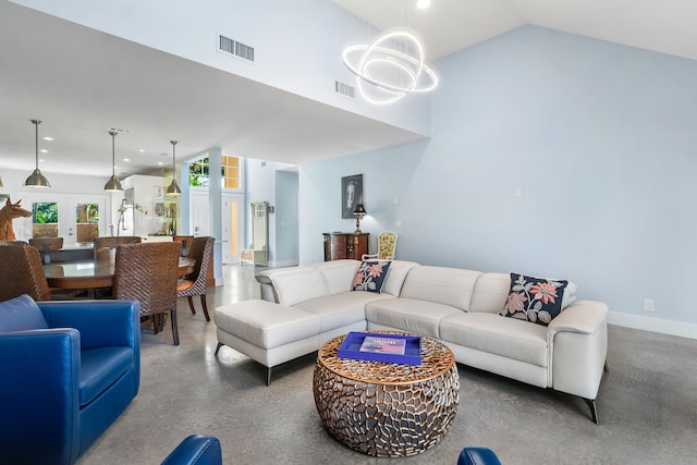 living room featuring french doors and lofted ceiling