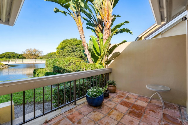 balcony featuring a water view