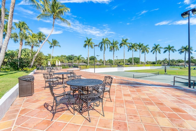 view of patio / terrace with tennis court