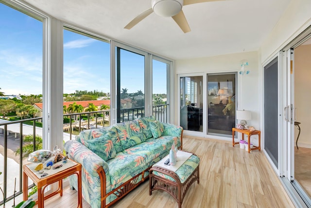 sunroom with ceiling fan and a healthy amount of sunlight