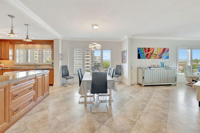 tiled dining space featuring a textured ceiling, crown molding, and a wealth of natural light