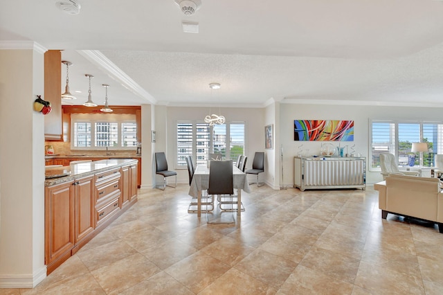 dining area with plenty of natural light and crown molding